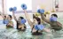 A group of people in an indoor pool holding float weights. Text Overlay: Aquasize (Ages: 13+)