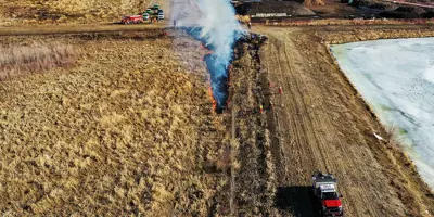 Firefighters performing hazard reduction training in field