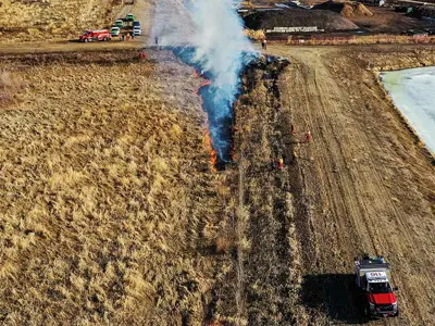 Firefighters performing hazard reduction training in field
